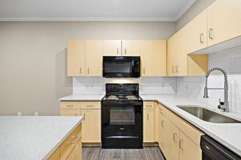 A kitchen with a stove and a sink